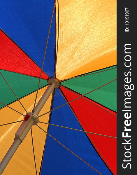 A colorful umbrella illuminated by the sun