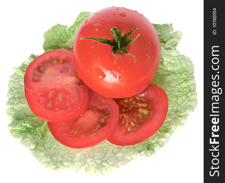 Tomato on salad leaf