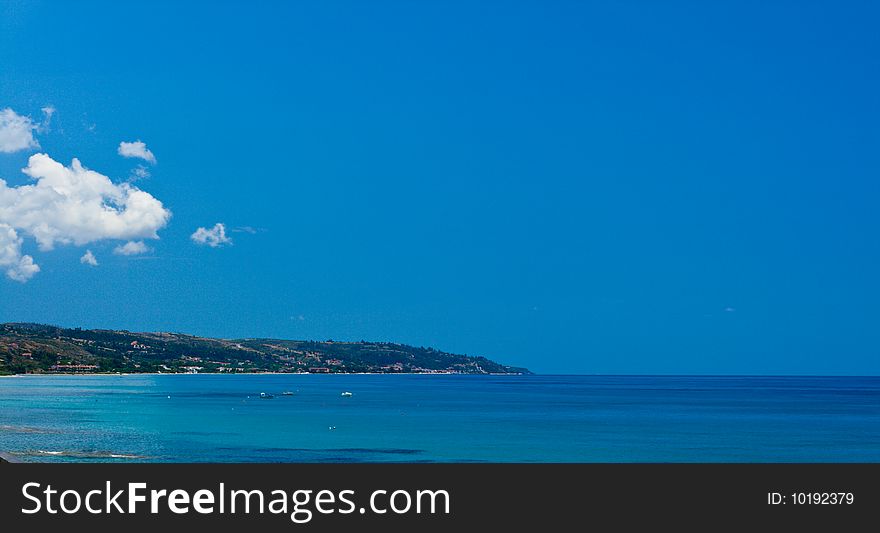 Seascape. Blue sky with clouds and water. Greece, Chalkidiki, Kassandra.