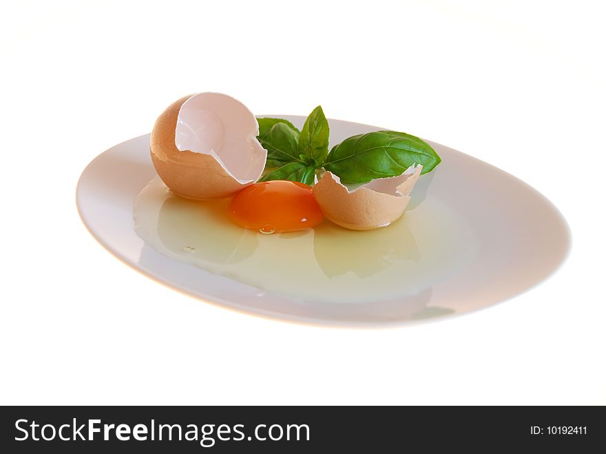 Egg with basil on a plate