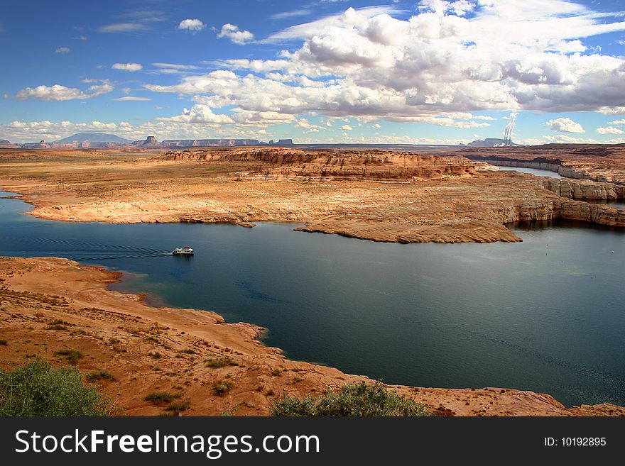 Navigation in deep blue water of Lake Powell - USA