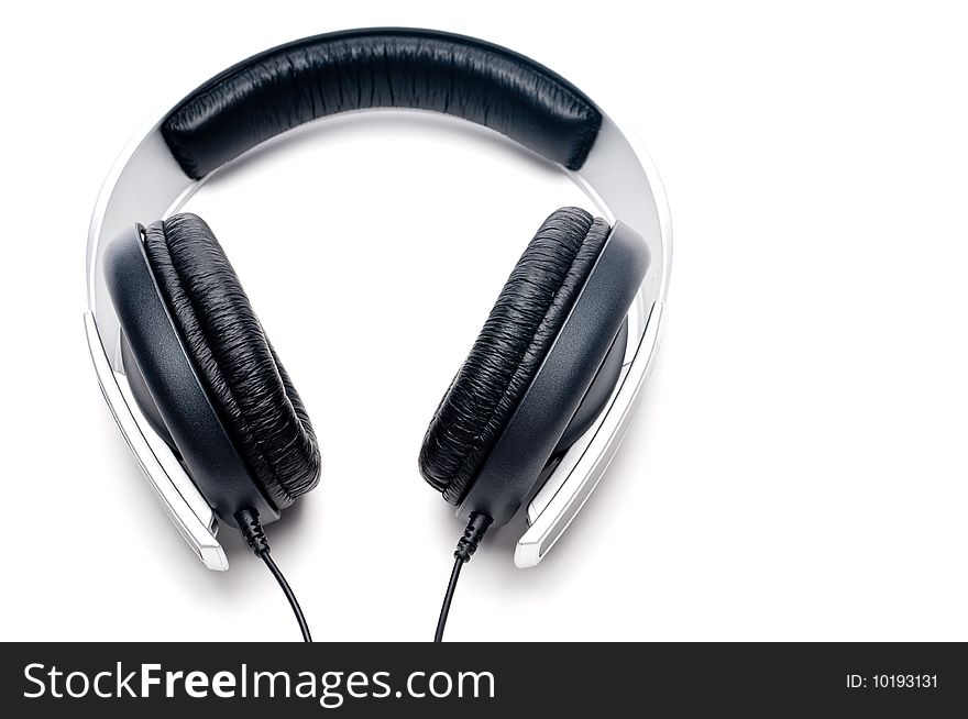 Horizontal image of silver colored headphones with black leather padding