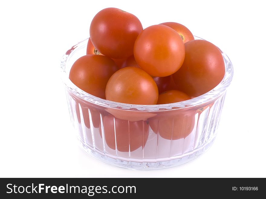 Little glass bowl with cherry tomatoes, isolated on white. Little glass bowl with cherry tomatoes, isolated on white.