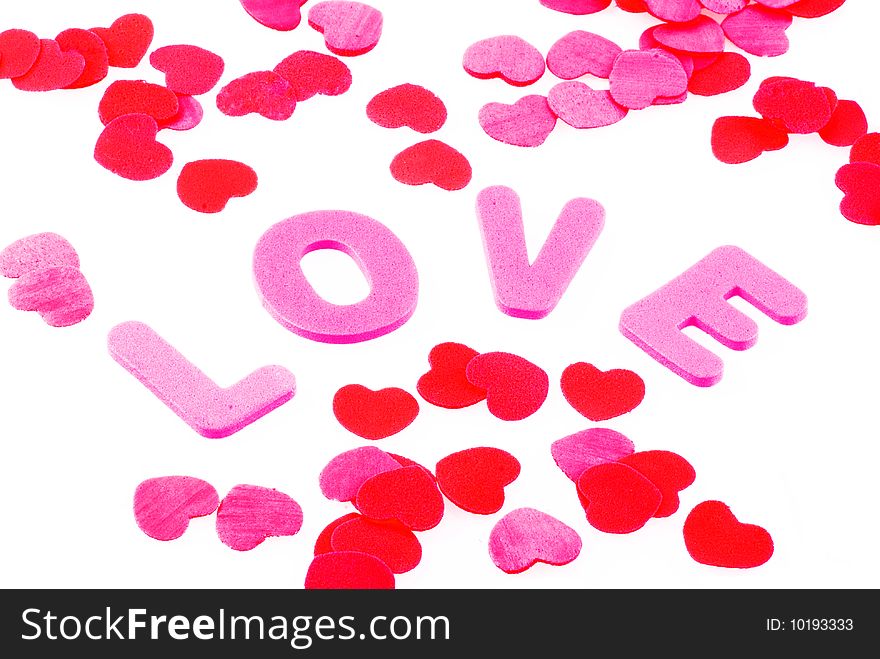 The word love surrounded by little hearts, isolated on white. The word love surrounded by little hearts, isolated on white.