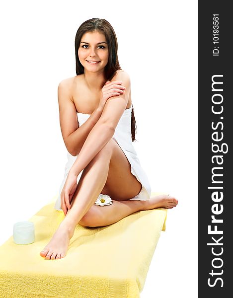 Beautiful woman with a towel for spa concept on white. Beautiful woman with a towel for spa concept on white