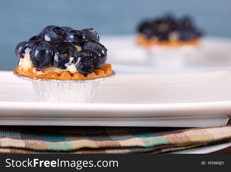 Delicious caramel custard tart layered with blueberries and drizzled with syrup. Delicious caramel custard tart layered with blueberries and drizzled with syrup