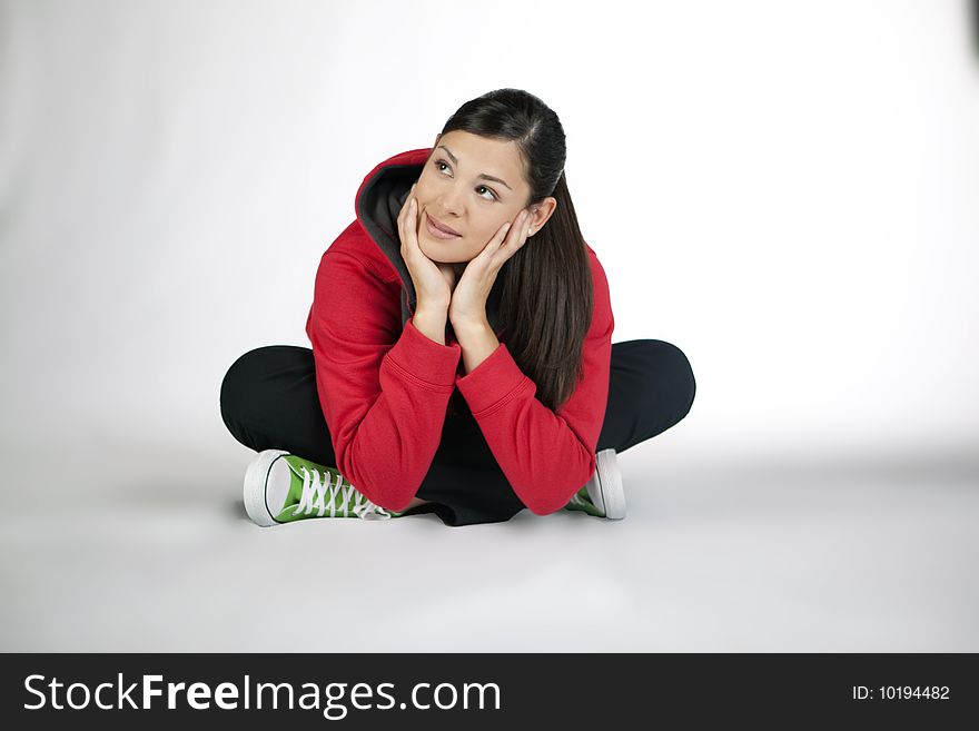 Cross-legged young woman dressed casual. Cross-legged young woman dressed casual