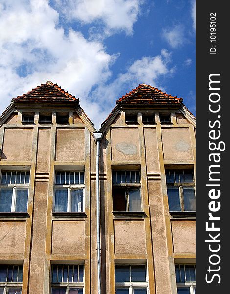 Interesting double roof on beautiful blue sky in Poznan