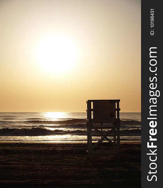 Empty lifegaurd chair at sunrise in Virginia Beach. Empty lifegaurd chair at sunrise in Virginia Beach