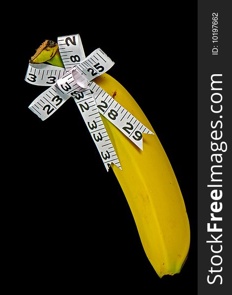 Measuring tape bow on banana. Measuring tape bow on banana.