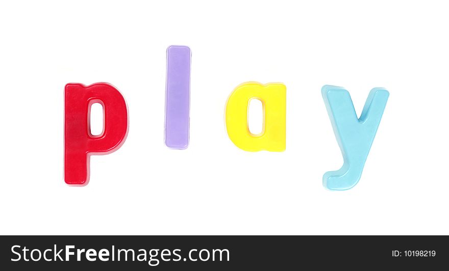 Play - Colourful Fridge Magnets On A White Background. Play - Colourful Fridge Magnets On A White Background