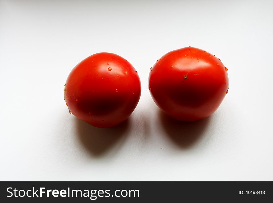 There are two tomatos indoor