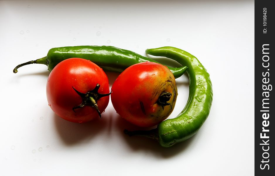 There are tomatos and chillies. There are tomatos and chillies