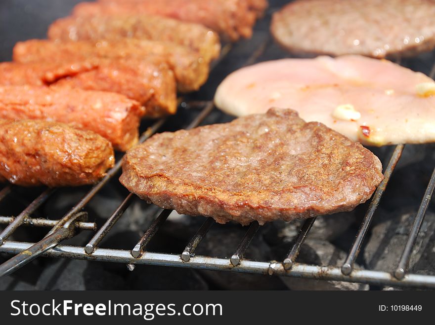 Various meat products on a brazier lattice. Various meat products on a brazier lattice