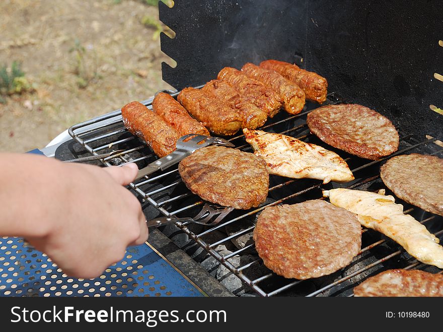 Various meat products on a brazier lattice. Various meat products on a brazier lattice