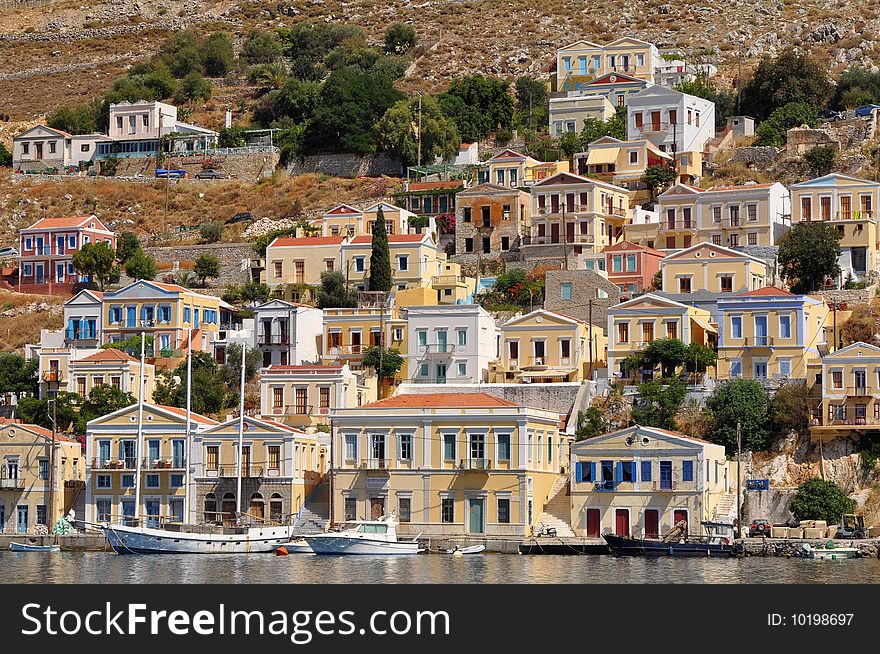 Multicolored Houses On An Island Symi