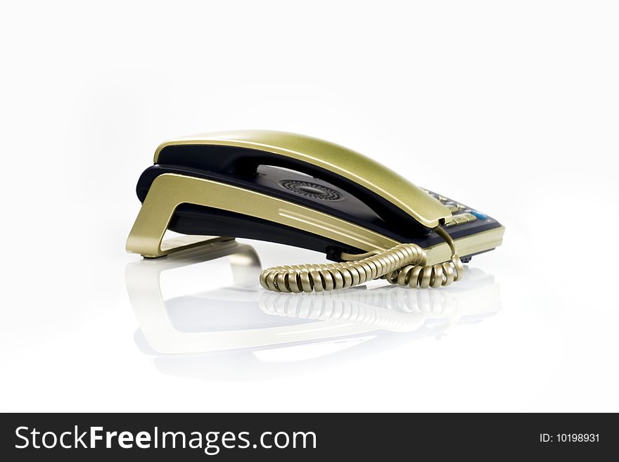 Desktop black phone with gold it is pending sonorous