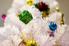 Festive Pine White - Christmas Decorative With Gift Box On Christmas Tree Royalty Free Stock Photography