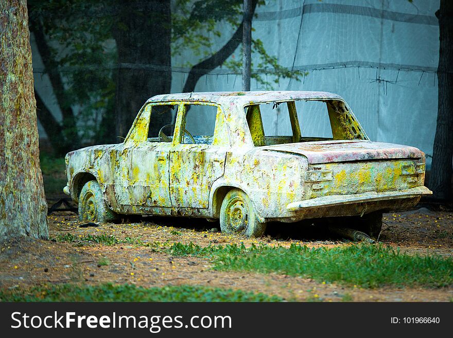 An Old Rusty Car In Paint From Paintball.