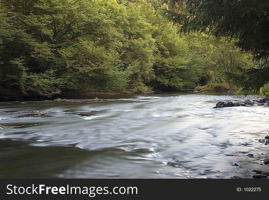 Flowing river ourthe in belgium