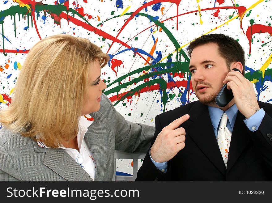 Professional woman and man on business call; paint splash background. Professional woman and man on business call; paint splash background