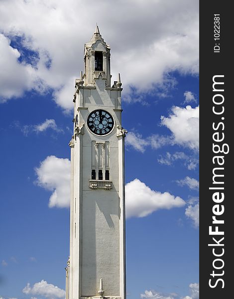 Old clock on a blue sky