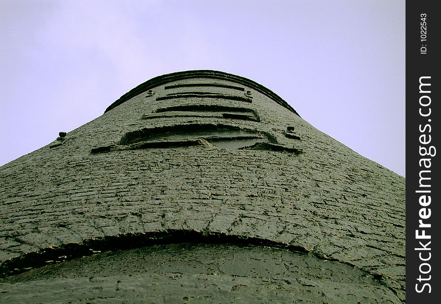 Close to the base of the remains of an old windmill, looking vertically upwards across the stonework. Close to the base of the remains of an old windmill, looking vertically upwards across the stonework.