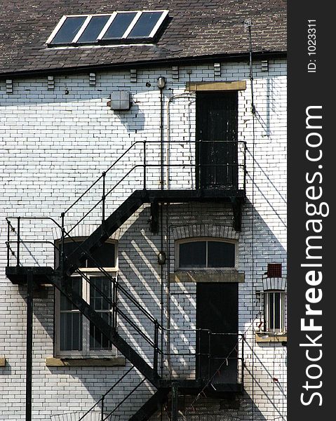 Warehouse fire escape on Leeds canal, West Yorkshire, UK