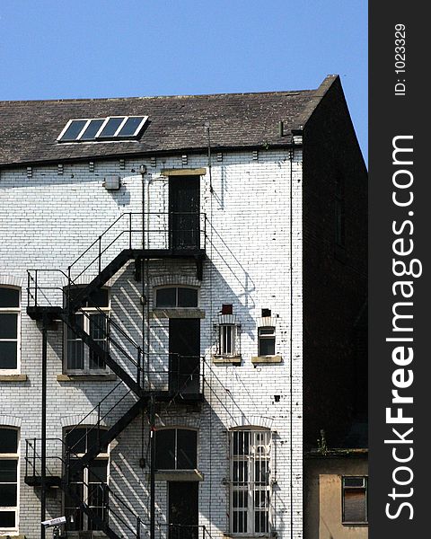 Warehouse fire escape on Leeds canal, West Yorkshire, UK