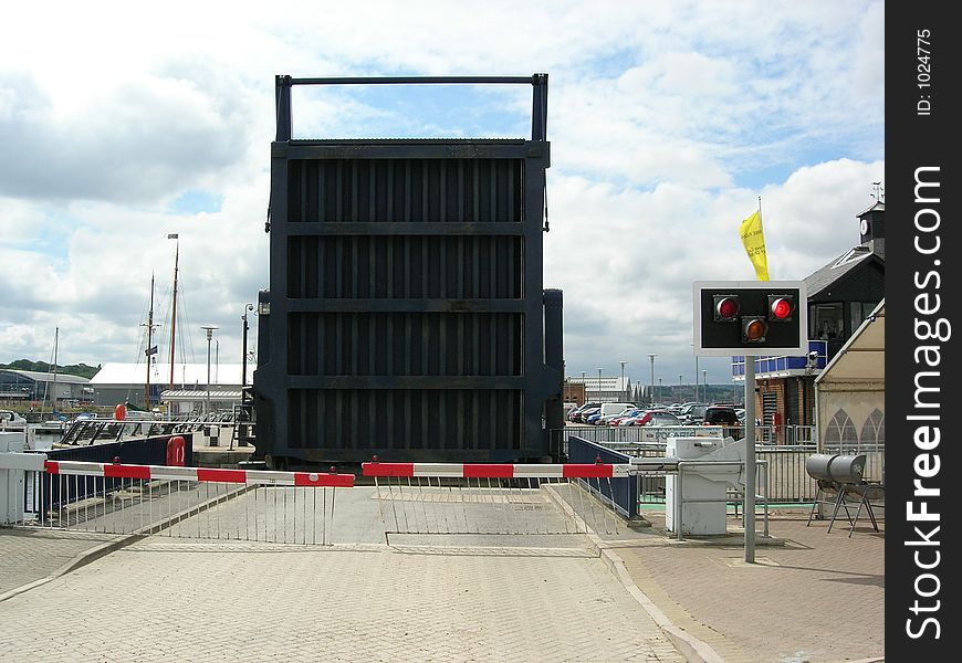 Road bridge is lifted to allow boats to enter the marina. Road bridge is lifted to allow boats to enter the marina