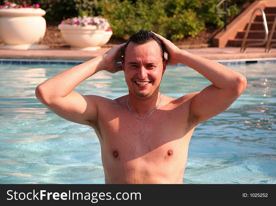 Man in pool posing. Man in pool posing