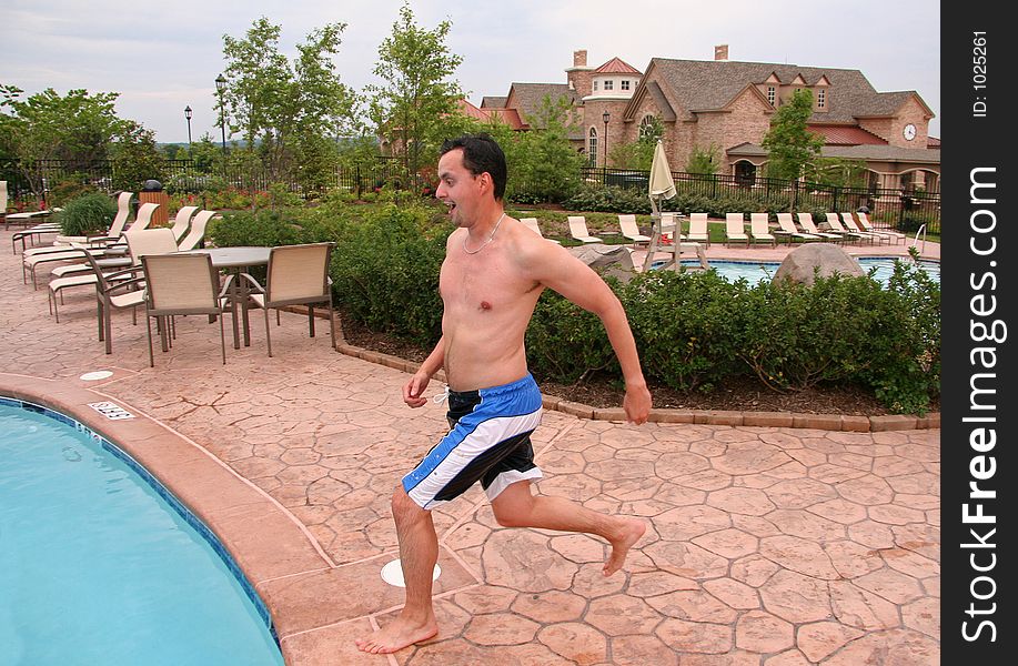 Man jumping into pool. Man jumping into pool