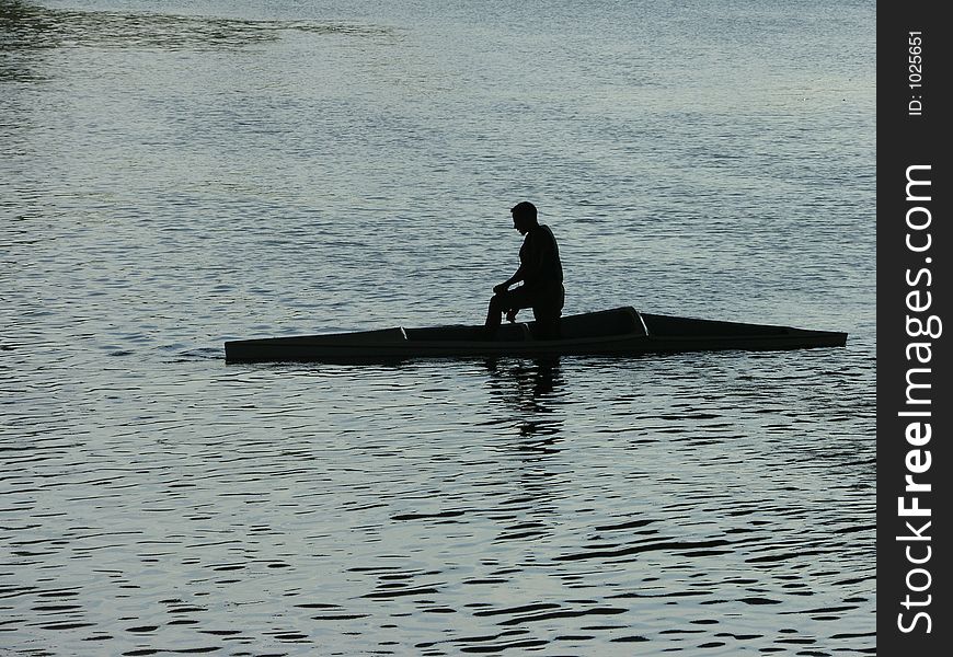 A men resting in the kayak. A men resting in the kayak