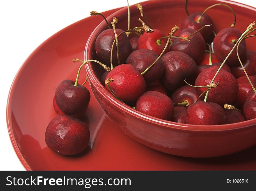 Bunch of cherries in a red bowl. Bunch of cherries in a red bowl