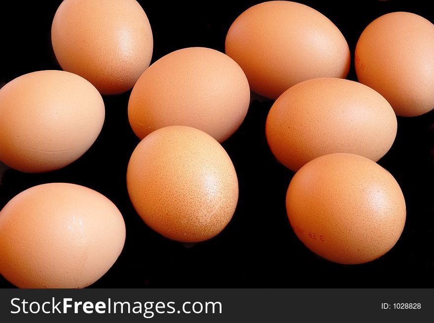 9 eggs on black background