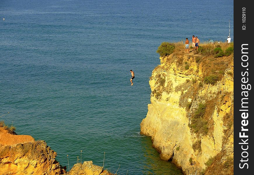 Jump for the water in Batata beach, Lagos, Portugal. Jump for the water in Batata beach, Lagos, Portugal.