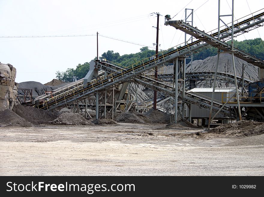 Multlple quarry conveyors with piles of coal and rock. Multlple quarry conveyors with piles of coal and rock