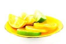 Citrus Fruit On A Yellow Plate Royalty Free Stock Images Citrus Fruit On A Yellow Plate Royalty Free Stock Images