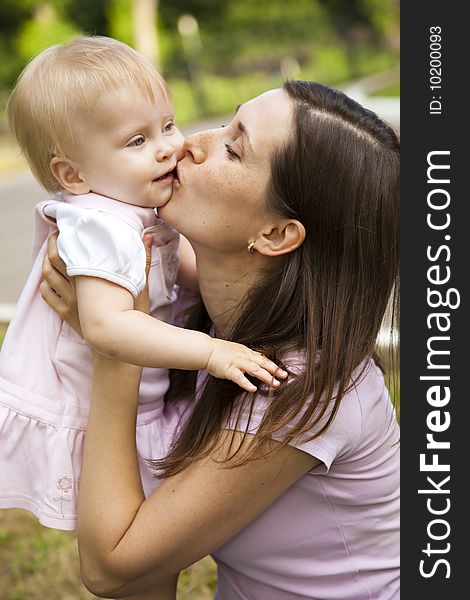 Woman holding her one year old daughter. Woman holding her one year old daughter