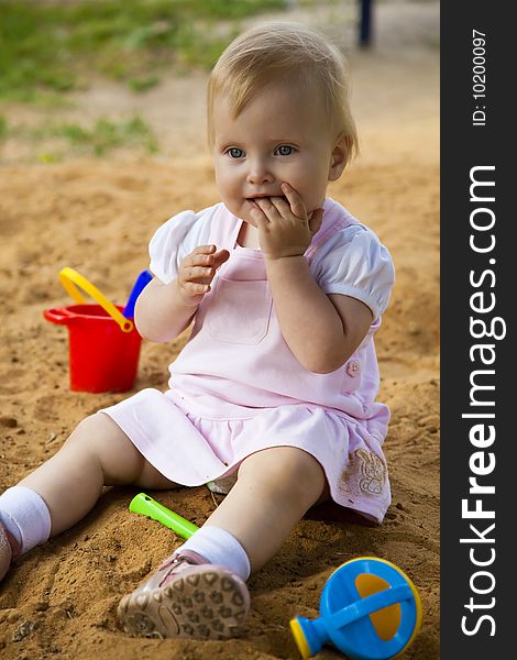 Little Girl In Sandbox