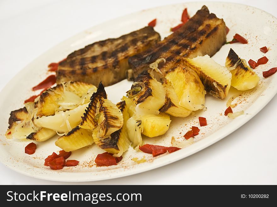 Roasted pork with rustic potato on a white plate decorated with bell pepper,see more in <a href=http://www.dreamstime.com/restaurant-food-rcollection10721-resi828293>Restaurant food</a>