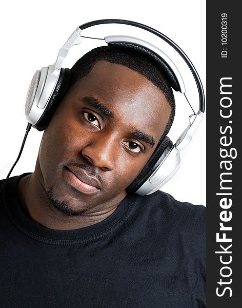 This is an image of young man with headphones on. This is an image of young man with headphones on.