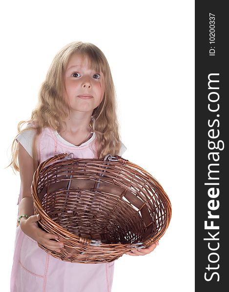 Shot of little girl playing with basket in studio