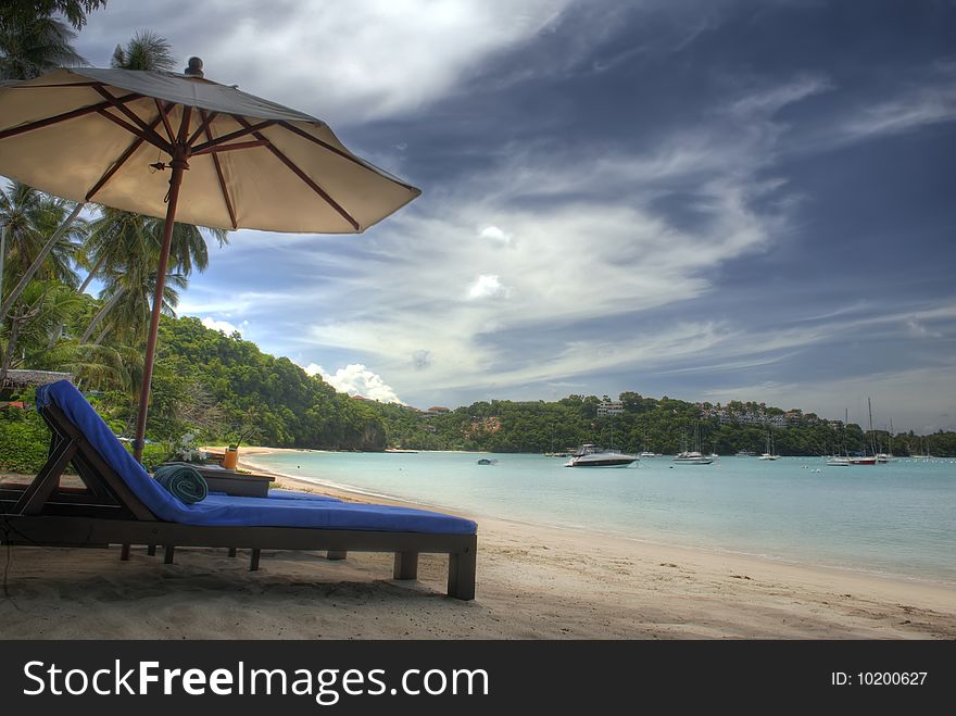 Lounge chair along the beach shore. Lounge chair along the beach shore