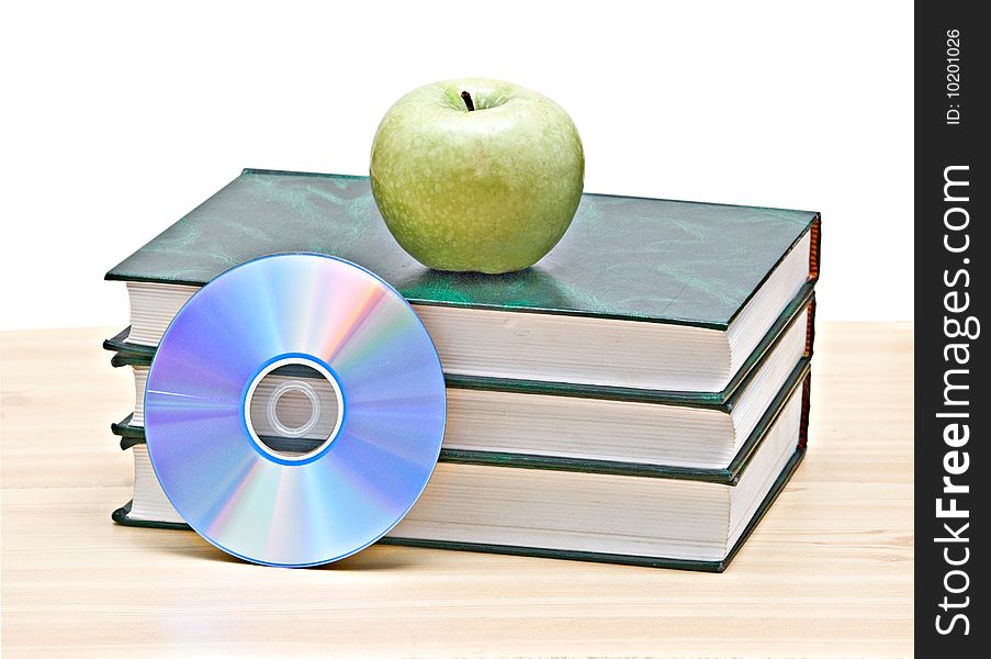 Apple, dvd, and books as a symbol of transition fron old to new mways of learning