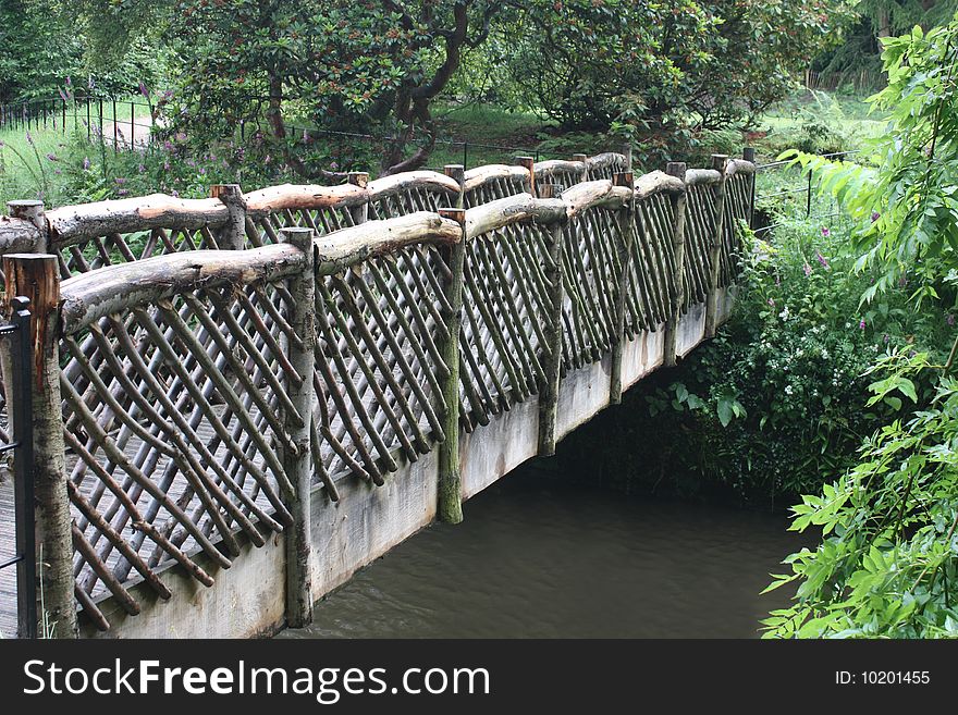 A Wooden Lattice Work River Crossing Bridge. A Wooden Lattice Work River Crossing Bridge.