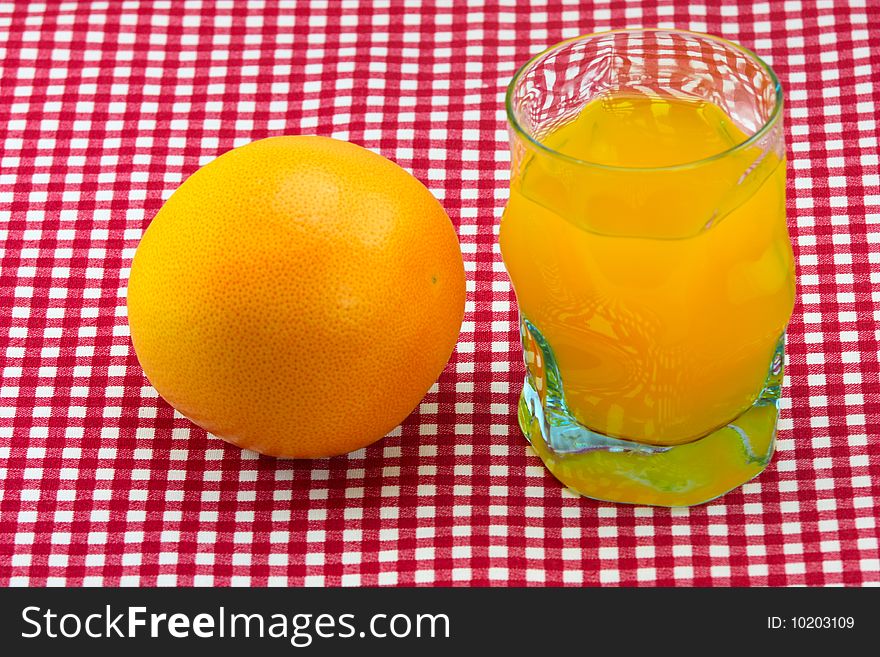 Glass of orange juice and fruit