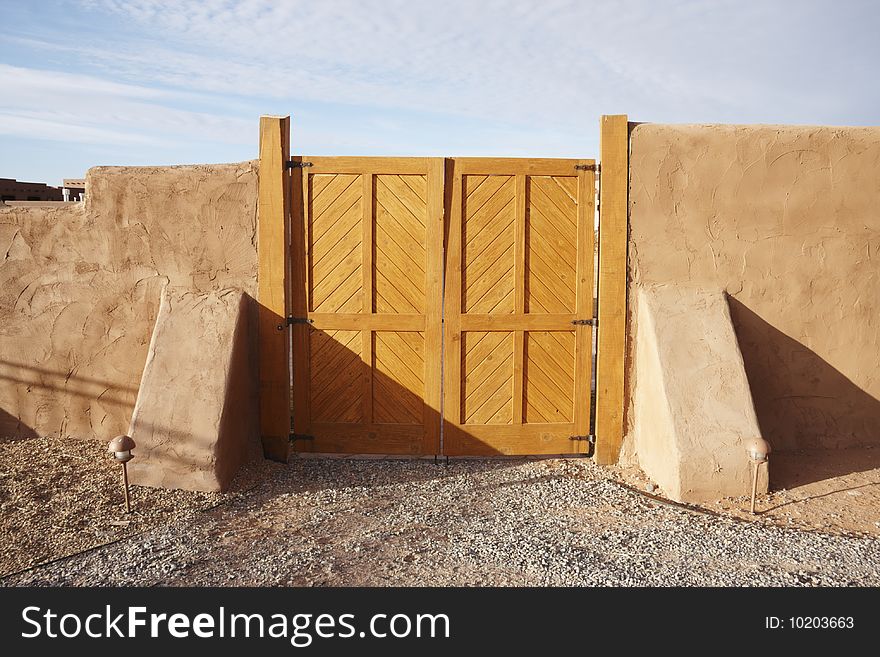 Wood gate and  brown fence. Wood gate and  brown fence