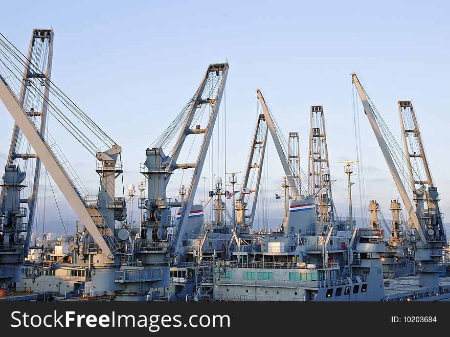 Cranes in dockside - perspective against blue sky