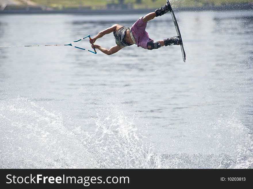 A picture of wakeboard competitor showing his jumping skill.